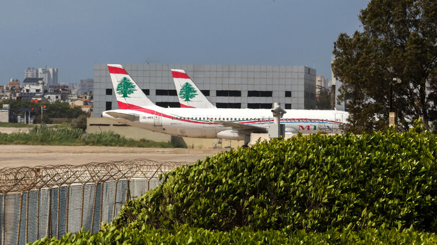 Middle East Airlines aircraft sit on the tarmac at Beirut's Rafik Hariri airport on April 10, 2026. Smoke from an Israeli strike still lingered in the air as a plane from Lebanon's national carrier took off from Beirut airport, which has stayed open despite the latest war between Israel and Hezbollah. The country's only international passenger facility, whose departure boards are now largely red with cancellations, is located on the Mediterranean coast at the edge of Beirut's southern suburbs. (Photo by Anw