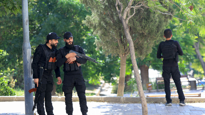 Syrian security forces patrol near France's President's hotel during his visit in Damascus on July 7, 2026. (Photo by Ludovic MARIN / POOL / AFP via Getty Images)