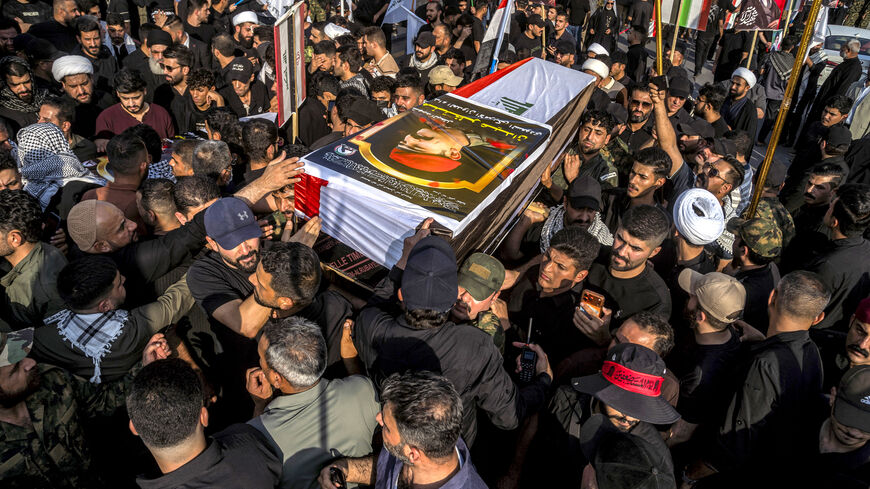 Mourners carry one of the bodies of members of Iraq's Hashed al-Shaabi, or Popular Mobilisation Forces (PMF) who were killed earlier in Diyala in central Iraq by US-Saudi strikes, during the funeral in Baghdad on July 29, 2026. The US-Saudi strikes killed at least 20 militants, including Iranians, according to the Hashed al-Shaabi. The US and Saudi Arabia said the strikes were in response to attacks on US forces and Saudi oil facilities. (Photo by murtadha ridha / AFP via Getty Images) /