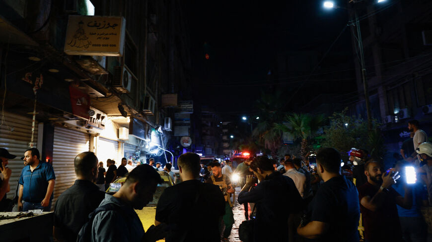 People gather at the site of an explosion, in Jaramana, Damascus countryside, Syria, August 6, 2026. REUTERS/Yamam Al Shaar