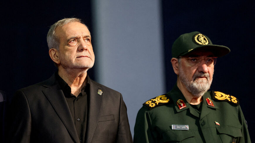 FILE PHOTO: Iranian President Masoud Pezeshkian and adviser to Iran's supreme leader Mohsen Rezaei attend a farewell ceremony for Iran's late Supreme Leader Ayatollah Ali Khamenei, who was killed on February 28 during Israeli and U.S. airstrikes on Iran, for international delegates at the Imam Khomeini Grand Mosalla in Tehran, Iran, July 3, 2026.  REUTERS/Mohammed Salem/File Photo