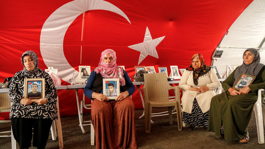 Women who call themselves “Diyarbakir Mothers” and say their sons were recruited by the outlawed Kurdistan Workers Party (PKK) hold pictures of their sons as they gather outside the local office of a pro-Kurdish party in the southeastern city of Diyarbakir, Turkey, August 11, 2026. REUTERS/Sertac Kayar
