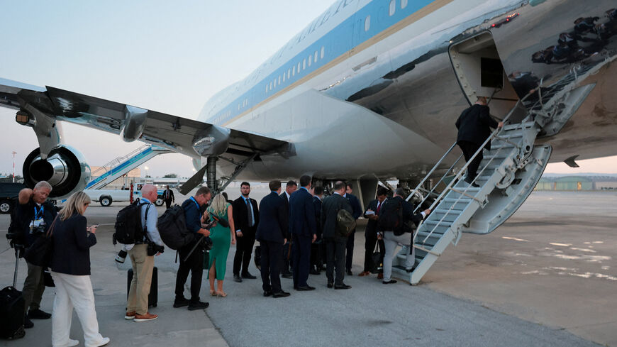 FILE PHOTO: People board Air Force One carrying U.S. President Donald Trump, en route to Washington after his participation in the NATO leaders' summit, at Ankara Esenboga Airport in Ankara, Turkey, July 8, 2026. REUTERS/Jonathan Ernst/File Photo