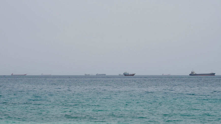 FILE PHOTO: Vessels near the Strait of Hormuz, as seen from Musandam, Oman, August 10, 2026. REUTERS/Stringer/File Photo