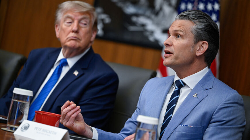 U.S. President Donald Trump listens as Secretary of Defense Pete Hegseth speaks during a cabinet meeting at Camp David in Thurmont, Maryland, U.S., July 31, 2026. REUTERS/Daniel Heuer/File Photo