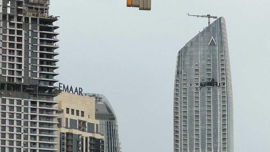A damaged building in the vicinity of Dubai Creek Harbour after a drone fell on it, amid the U.S.-Israeli conflict with Iran, in Dubai, United Arab Emirates, March 12, 2026. Picture taken with a mobile phone. REUTERS/Stringer