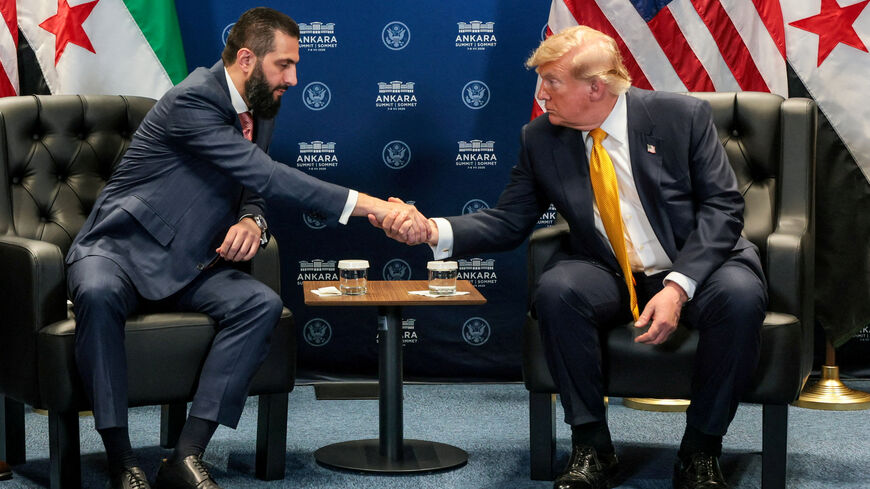 FILE PHOTO: U.S. President Donald Trump shakes hands with Syrian President Ahmed al-Sharaa during a bilateral meeting alongside the NATO leaders summit at the Bestepe Presidential Compound in Ankara, Turkey, July 8, 2026. REUTERS/Jonathan Ernst/File Photo