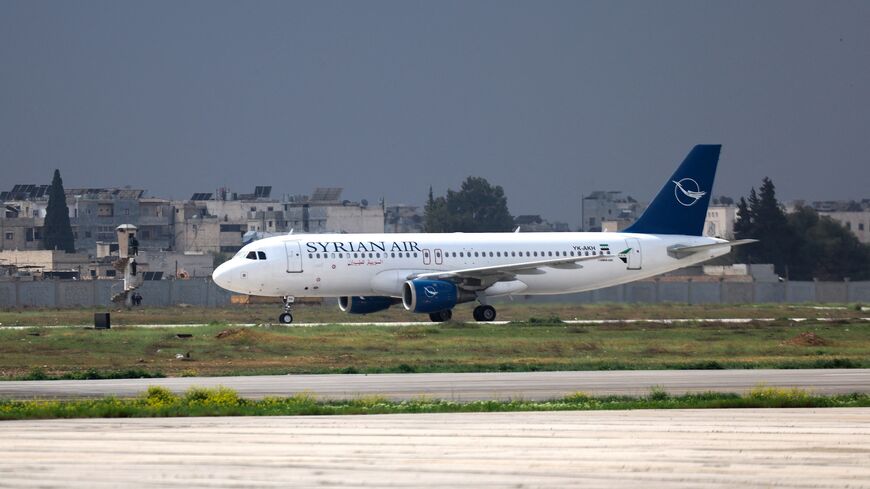 A Syrian Air passenger jet lands at Aleppo airport on March 18, 2025, the first aircraft to land after it was shut during the offensive that toppled former President Bashar al-Assad.