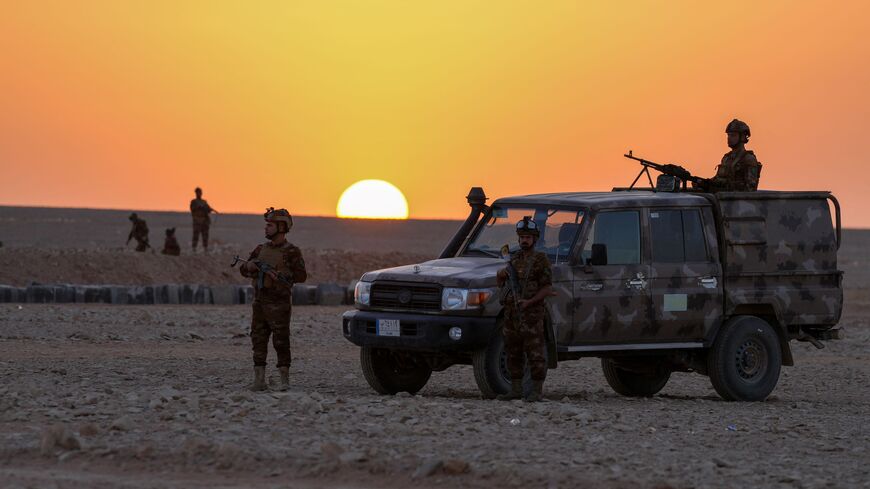 Iraqi army troops patrol the Iraq-Saudi Arabia border