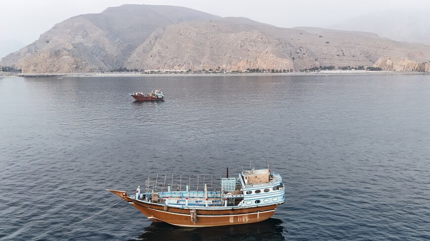 This aerial photograph shows boats anchored off Oman's northern Musandam Peninsula near the Strait of Hormuz on June 27, 2026. 