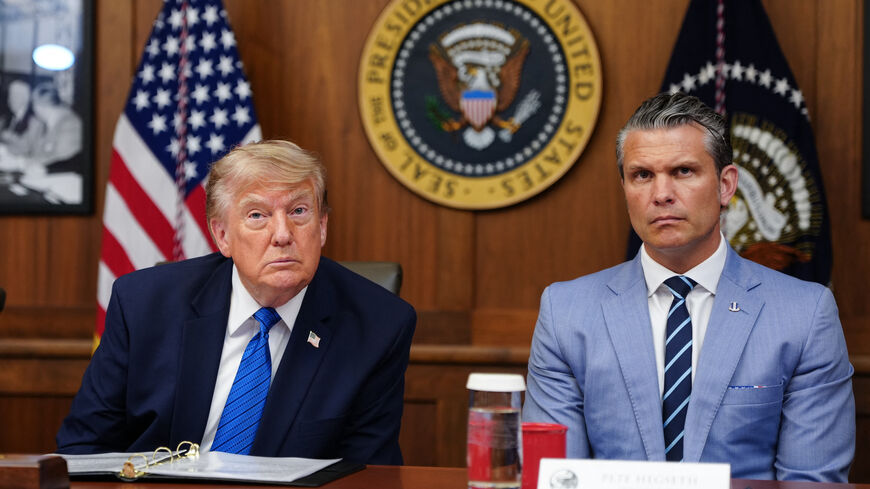 US President Donald Trump and US Secretary of Defense Pete Hegseth listen to questions from the press during a Cabinet meeting at Camp David in Maryland, on July 31, 2026.