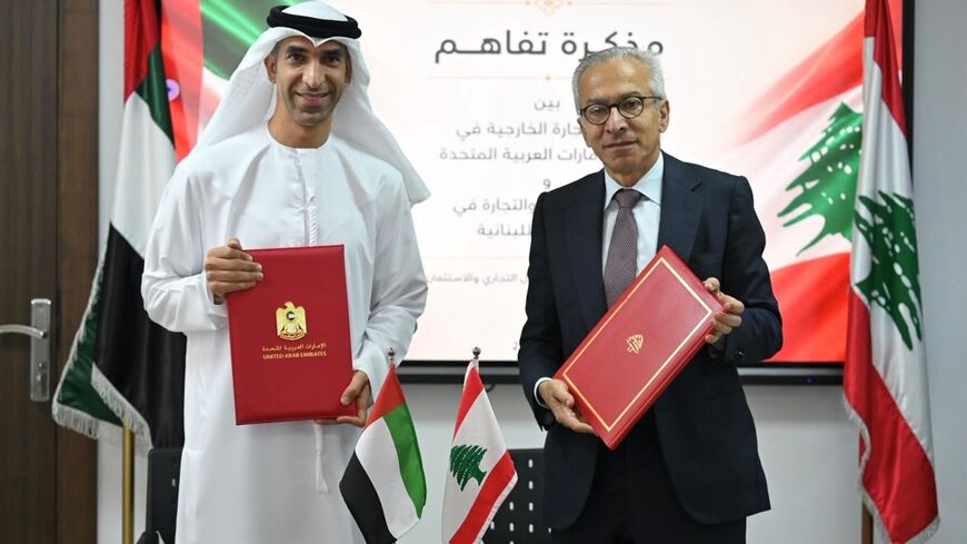UAE Foreign Trade Minister Thani bin Ahmed Al Zeyoudi (L) and Lebanese Economy Minister Amr al-Bisat after signing a memorandum of understanding, Beirut, Aug. 27, 2026.