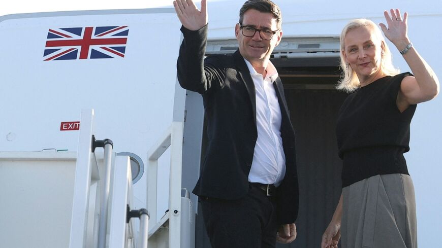 Britain's Prime Minister Andy Burnham and his wife Marie-France van Heel board a plane for the United States, to attend the 81st United Nations General Assembly (UNGA) in New York City, at Stansted Airport, north of London on September 21, 2026