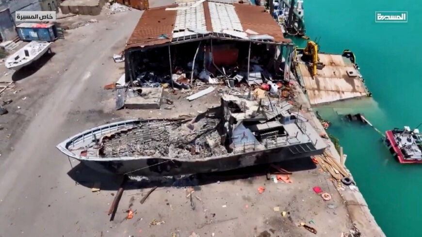 An aerial view shows a damaged boat in Mocha