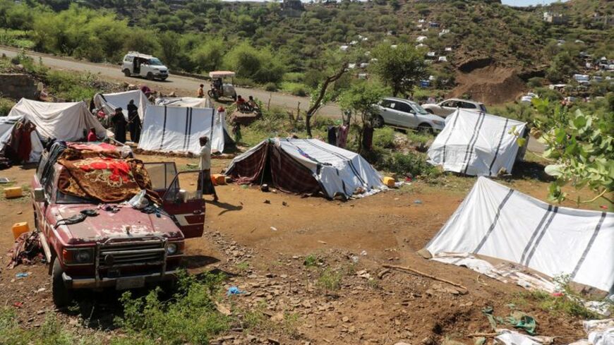 Displaced Yemenis take shelter at a makeshift camp in Taiz province