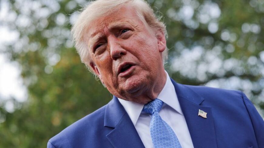 US President Donald Trump speaks to the media at the White House driveway following a luncheon for tech leaders in the East Room, in Washington