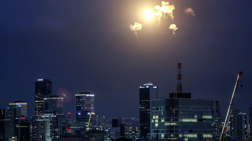 TOPSHOT - Explosions from projectile interceptions by Israel's Iron Dome missile defence system are pictured over Tel Aviv on February 28, 2026. The United States and Israel launched strikes against Iran on February 28, with Israel's public broadcaster reporting that the Iranian supreme leader had been targeted, as the Islamic republic retaliated with barrages of missiles at Gulf states and Israel. (Photo by Jack GUEZ / AFP via Getty Images)