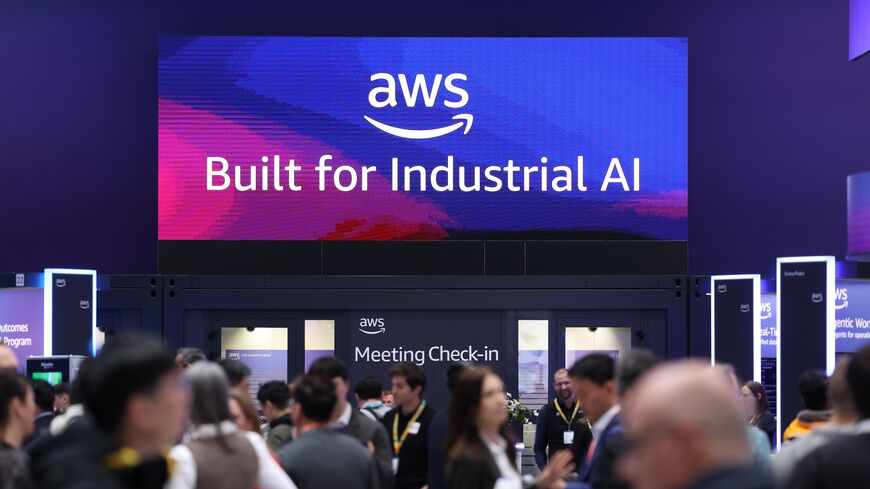 Visitors crowd the Amazon Web Services exhibition stand at the 2026 Hannover Messe industrial trade fair on April 20, 2026, in Hanover, Germany. 