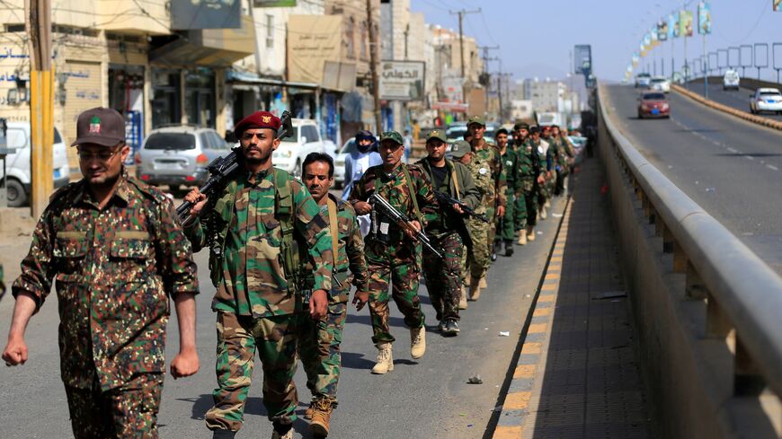 Houthi fighters marching