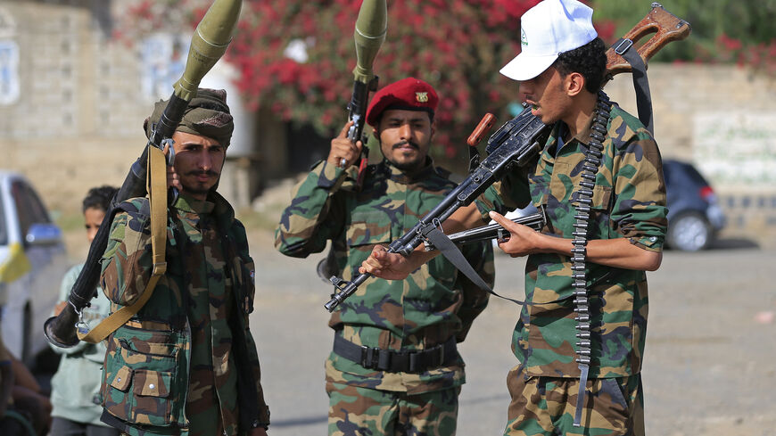 Fighters loyal to the Houthi authorities, brandish their weapons during a rally to recruit more fighters, in Sanaa on September 10, 2026. The country relapsed into war in July after years of calm, drawn into the regional conflict triggered by the US-Israeli offensive against Iran that began at the end of February. (Photo by Mohammed HUWAIS / AFP via Getty Images)