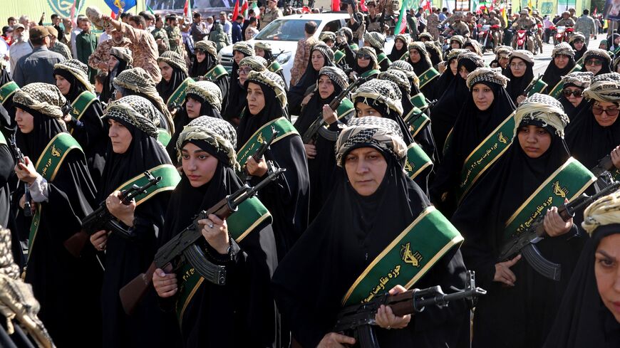 Members of Iran's Basij paramilitary force march with riffles during a military rally named Jan-Fada in Tehran, Sept. 18, 2026.