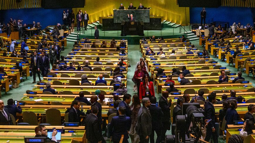 Prime Minister of Israel Benjamin Netanyahu waves to delegates leaving before his UN speech