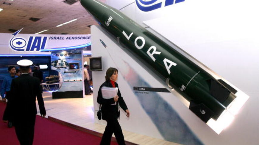 A woman walks past a model of a Lora missile, Israel's long range artillery missile at the Israel defence stall at the international DefExpo 2008 defence fair, in New Delhi on February 16, 2008. India kicked off South Asia's largest defence fair, with hundreds of global weapons firms offering their latest hardware to the country's technology-hungry military. About 450 weapons companies from 30 countries are present at the four-day "DefExpo" in New Delhi, with several big-ticket announcements expected. AFP P