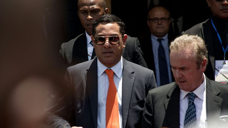 Mamy Ravatomanga (centre) is detained in Mauritius and faces money laundering accusations