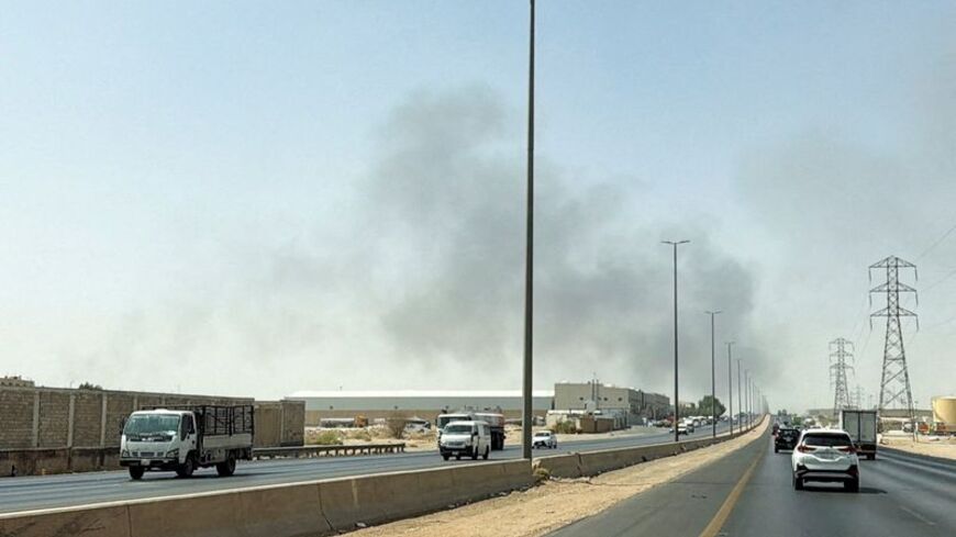Smoke rises from a fire at the Aramco refinery south of Riyadh