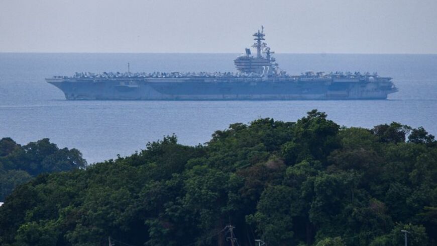 USS George H.W. Bush arrives for retreat after supporting operations in Middle East, in Phuket