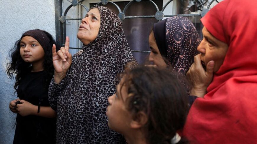 People mourn Palestinians who were killed in an Israeli air strike, according to medics, in Gaza City