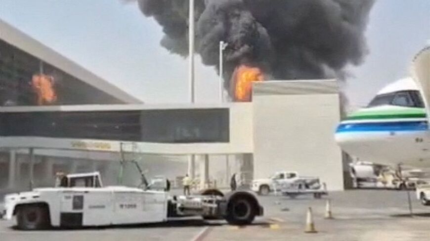 Smoke and flames rise from King Khalid Airport, after Yemen's Iran-backed Houthis said they attacked the airport, in Riyadh