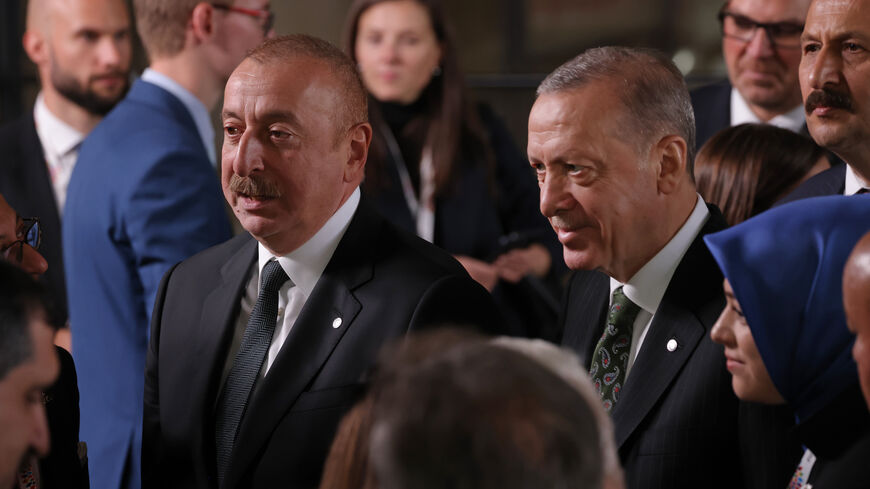 Azerbaijan President Ilham Aliyev (L) and Turkish President Recep Tayyip Erdogan attend the inaugural meeting of the European Political Community (EPC) at Prague Castle on Oct. 6, 2022 in Prague, Czech Republic. 