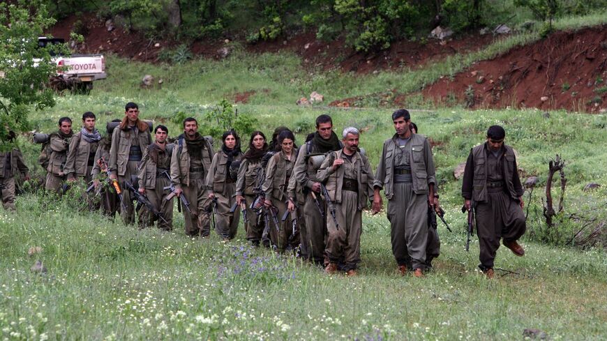 Kurdistan Workers Party (PKK) fighters arrive in the northern Iraqi city of Dohuk on May 14, 2013, after leaving Turkey as part of a peace drive with Ankara. 