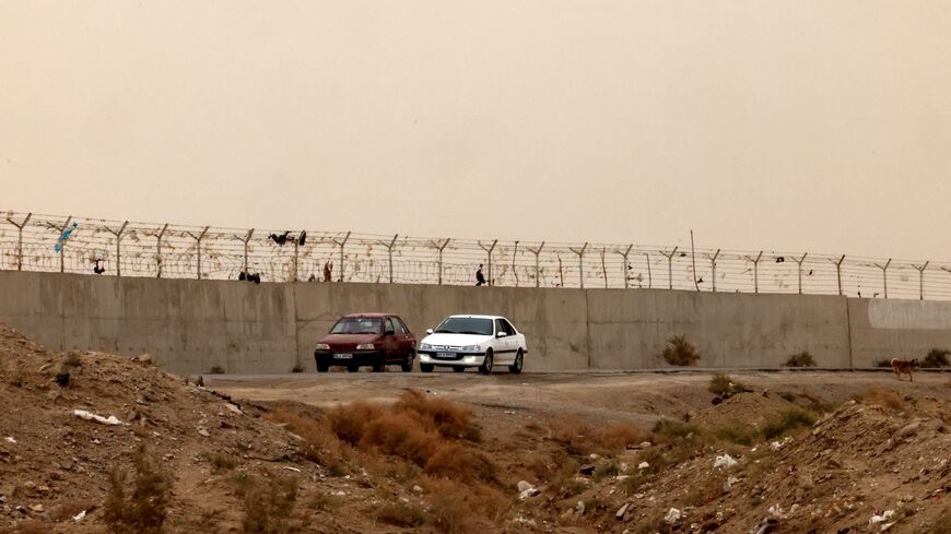 This picture shows the border wall between Iran and Afghanistan at the Milak border crossing near the town of Zabol, in the southeastern province of Sistan and Baluchistan bordering Afghanistan, on Dec. 17, 2025. 