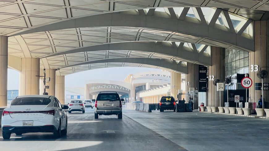 Cars drive past the gates of King Khalid International Airport in Riyadh on Sept. 19, 2026. 