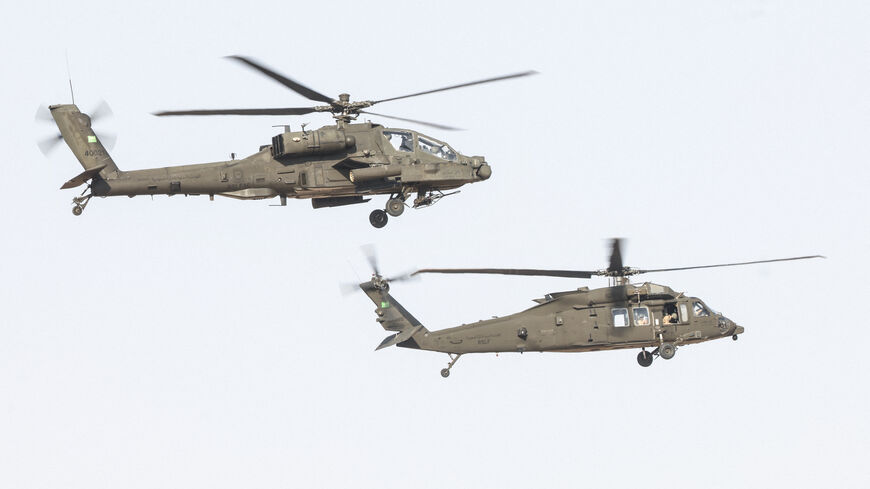 Royal Saudi Air Force (RSAF) AH-64 Apache (top) and UH-60 Black Hawk helicopters perform a flypast during a military parade marking the 96th Saudi National Day in Riyadh on September 22, 2026. (Photo by Fayez Nureldine / AFP via Getty Images)