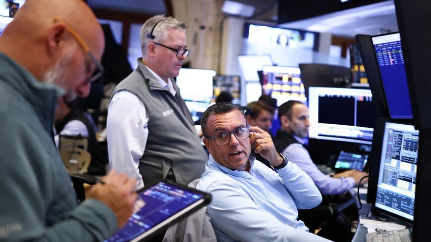 Traders work on the floor of the New York Stock Exchange at the opening bell, New York City, Sept. 28, 2026. 