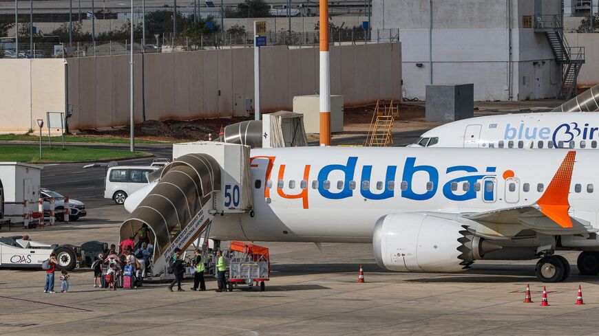Passengers board a flydubai flight, bound for Dubai, before taking off from Ben Gurion Airport near Tel Aviv, on Sept. 30, 2026. 