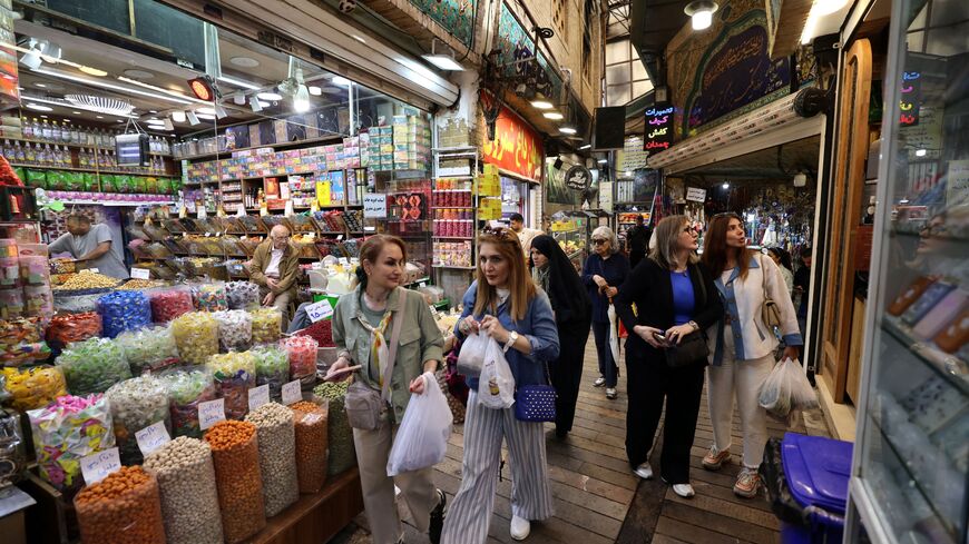 shoppers walking through the Tajrish Bazaar, a traditional market in Tehran