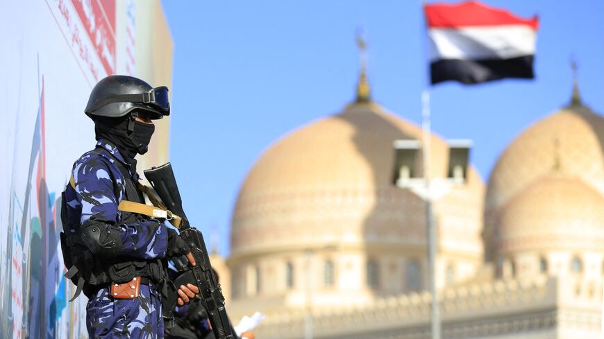 A security force member stands guard during a protest against Saudi intervention in Yemen, in Sanaa, on Oct. 9, 2026. 