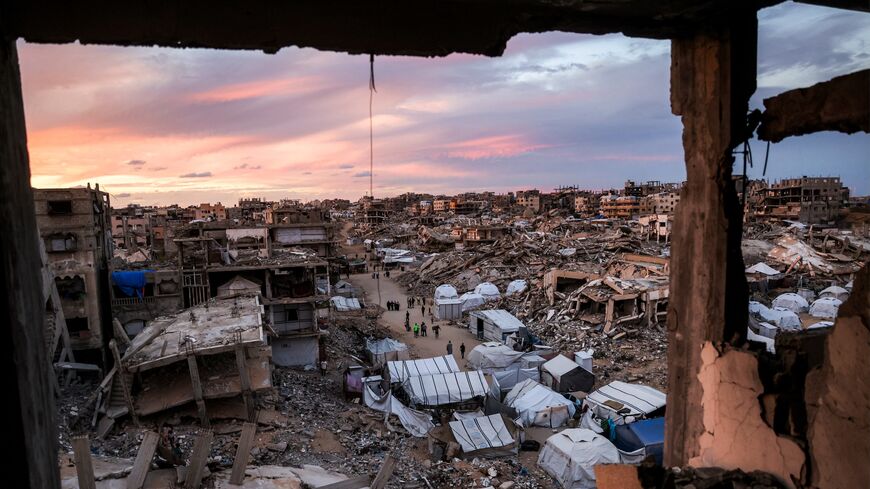 Tents sheltering Palestinians displaced by the Hamas-Israeli war are pitched between the rubble of destroyed buildings in the Jabalia camp, northern Gaza Strip, Oct. 20, 2026.