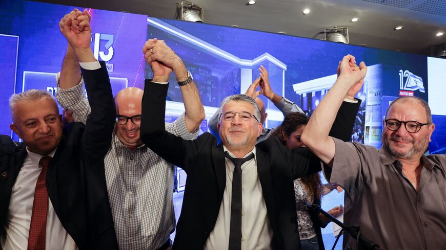 Yousef Jabareen, leader of Israel's Arab-led Joint List political alliance (C-L), and other members cheer at the alliance's campaign headquarters in the northern Israeli city of Nazareth on Oct. 27, 2026.