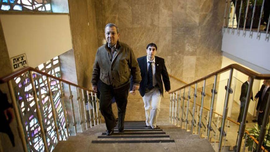 Israel's Defence Minister Ehud Barak (L) arrives to the weekly cabinet meeting in Jerusalem December 25, 2011. REUTERS/Uriel Sinai/Pool (JERUSALEM - Tags: POLITICS)