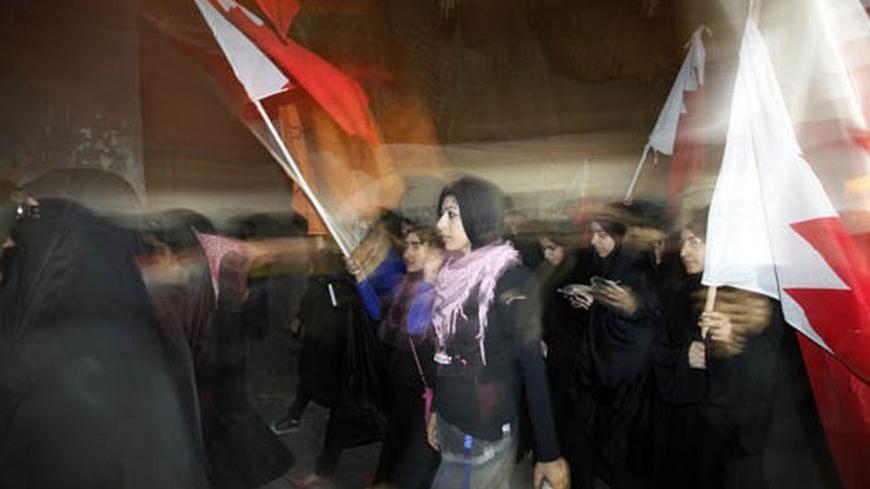 Zainab al-Khawaja (C), daughter of human rights activist Abdulhadi al-Khawaja, takes part in a rally held in support of her father in the village of Bani-Jamra, west of Manama March 11, 2012. Supporters of human rights activist Abdulhadi al-Khawaja came out onto the streets in various villages in Bahrain asking for his release. Al-Khawaja is on his 32nd day of a hunger strike in prison, after being convicted by Bahrain's military court. REUTERS/Hamad I Mohammed (BAHRAIN - Tags: CIVIL UNREST POLITICS)