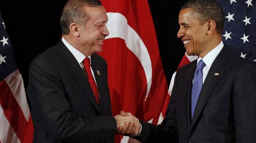 U.S. President Barack Obama (R) shakes hands with Turkey's Prime Minister Recep Tayyip Erdogan after a bilateral meeting ahead of the Nuclear Security Summit in Seoul March 25, 2012. REUTERS/Larry Downing (SOUTH KOREA - Tags: POLITICS MILITARY)