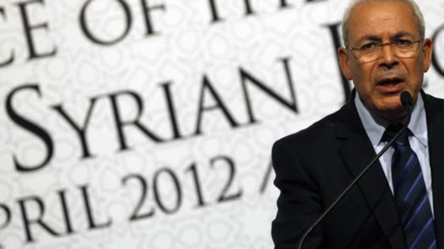 Syrian National Council (SNC) President Burhan Ghalioun speaks during a news conference at the "Friends of Syria" conference in Istanbul April 1, 2012. Western and Arab nations stepped up verbal pressure on Syrian President Bashar al-Assad on Sunday, mistrusting his acceptance of a plan to end a year of bloodshed, but stopped short of arming rebels or fully recognising an opposition council. REUTERS/Murad Sezer (TURKEY - Tags: POLITICS)