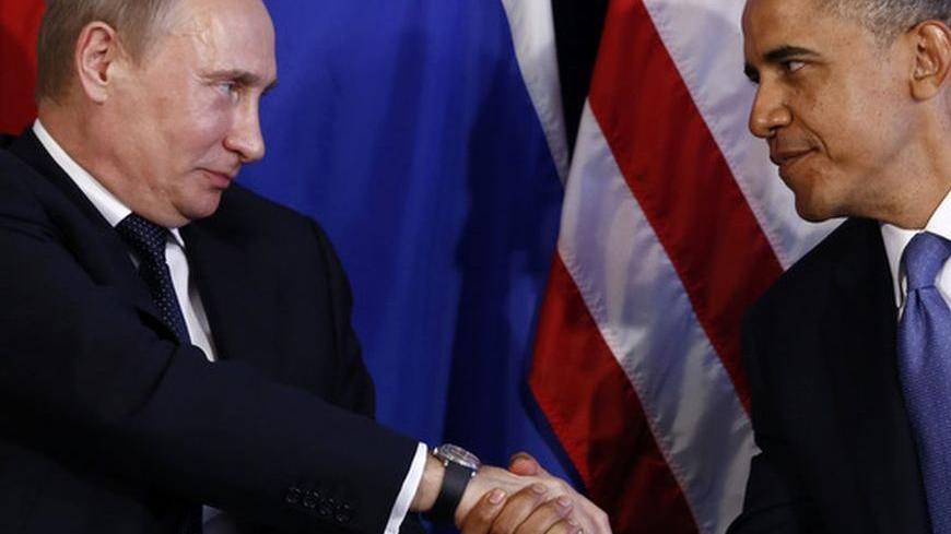 U.S. President Barack Obama (R) shakes hands with Russia's President Vladimir Putin in Los Cabos, Mexico, June 18, 2012. The leaders are in Los Cabos to attend the G20 summit. REUTERS/Jason Reed (MEXICO - Tags: POLITICS)