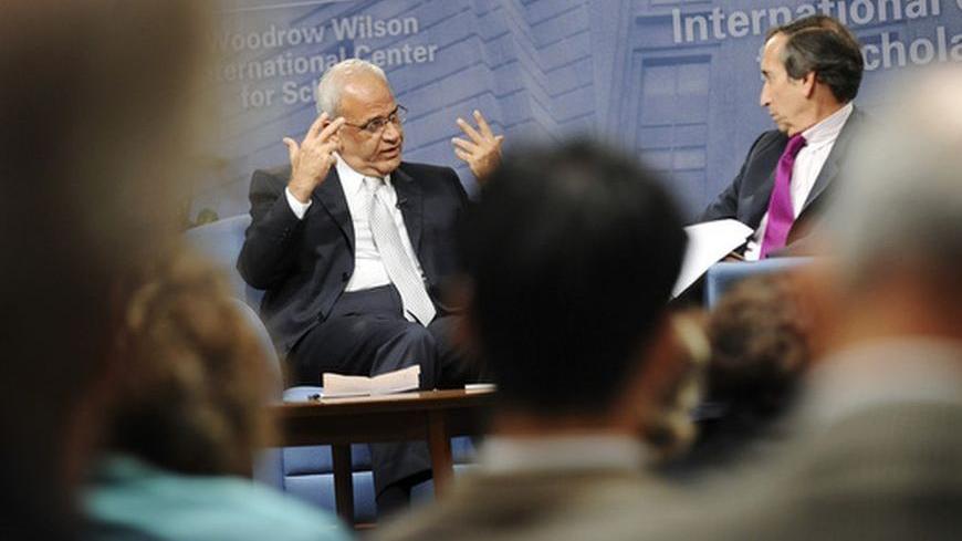 Senior Palestinian negotiator Saeb Erekat (L) speaks during a question-and-answer forum with moderator Aaron David Miller (R) at the Woodrow Wilson Center in Washington, November 4, 2010. REUTERS/Jonathan Ernst (UNITED STATES - Tags: POLITICS)