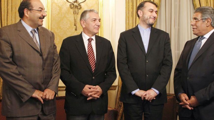 (L-R) Nasser al-Boreique, Saudi assistant to foreign minister, Omar Onhon, former Turkish ambassador to Syria, Hassan al-Amir, Iranian assistant to foreign minister, and Shawqi Ismail, Egyptian assistant to foreign minister, talk before their meeting in Cairo, September 10, 2012. Diplomats from Egypt, Iran, Saudi Arabia and Turkey met in Cairo to discuss on the crisis in Syria. REUTERS/Asmaa Waguih (EGYPT - Tags: POLITICS)